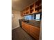 Modern kitchen with granite countertops, stainless steel sink, sleek faucet, and ample cabinet space above and below the counter at 10785 W 63Rd Pl # 105, Arvada, CO 80004