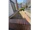 Landscaped brick planter provides a decorative accent adding charm to the home's exterior at 10785 W 63Rd Pl # 105, Arvada, CO 80004