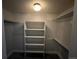 Walk-in closet equipped with shelving units and ample storage space to organize wardrobe items at 10785 W 63Rd Pl # 105, Arvada, CO 80004