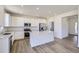 Eat-in kitchen with stainless steel appliances, ample counter space, and bright lighting at 5581 Inland Ave, Firestone, CO 80504