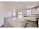 Open concept kitchen, quartz countertops and stainless steel appliances with an eat-in kitchen at 5581 Inland Ave, Firestone, CO 80504
