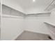 Walk-in closet with ample shelving to maximize organization and storage at 5581 Inland Ave, Firestone, CO 80504