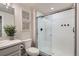 Bathroom featuring a glass enclosed shower, white subway tile, and a floating vanity at 10723 Sedalia St, Commerce City, CO 80022