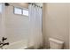 Clean bathroom featuring a white bathtub and shower with a white decorative curtain at 10723 Sedalia St, Commerce City, CO 80022