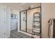 Bathroom featuring a glass enclosed shower with subway tile and decorative black metal storage at 10723 Sedalia St, Commerce City, CO 80022