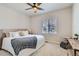 Cozy bedroom with a ceiling fan, window with blinds, and neutral decor at 10723 Sedalia St, Commerce City, CO 80022