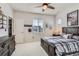Bedroom with wood furniture, a ceiling fan, and natural lighting from the window at 10723 Sedalia St, Commerce City, CO 80022