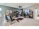 Inviting bonus room with ample space, eclectic decor, and abundant natural light at 10723 Sedalia St, Commerce City, CO 80022