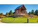 Charming community building with attractive architecture, lush landscaping, and inviting atmosphere at 10723 Sedalia St, Commerce City, CO 80022