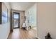Bright entryway with hardwood floors, natural light, and stylish decor at 10723 Sedalia St, Commerce City, CO 80022