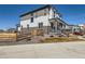 Stylish two-story home with a fenced yard and inviting covered porch at 10723 Sedalia St, Commerce City, CO 80022