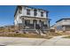 Attractive two-story home showcasing a covered front porch and well-maintained landscaping at 10723 Sedalia St, Commerce City, CO 80022