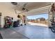 Spacious garage with ample storage solutions, organized tool racks, and a clean, well-maintained floor at 10723 Sedalia St, Commerce City, CO 80022
