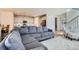 Spacious living area with modern decor, open to the kitchen, perfect for entertaining at 10723 Sedalia St, Commerce City, CO 80022
