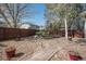 Landscaped backyard with stone mulch, a path and a wood fence at 13087 Krameria St, Thornton, CO 80602