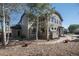 Beautiful backyard featuring neutral siding, a large tree, a patio and mature landscaping at 13087 Krameria St, Thornton, CO 80602