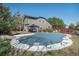 Large backyard with a swimming pool covered by a safety cover and a patio at 13087 Krameria St, Thornton, CO 80602
