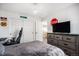 Bedroom with rustic decor, large dresser, and adjacent hallway view at 13087 Krameria St, Thornton, CO 80602