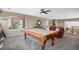 Entertaining game room featuring a pool table, comfortable seating, and natural light at 13087 Krameria St, Thornton, CO 80602