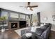 Cozy living room with a fireplace, comfortable seating, and natural light at 13087 Krameria St, Thornton, CO 80602