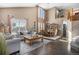 Spacious living room with tall windows, hardwood floors, and elegant dining area at 13087 Krameria St, Thornton, CO 80602