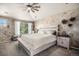 Serene main bedroom with textured wall, neutral tones, and ample natural light at 13087 Krameria St, Thornton, CO 80602
