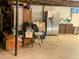 Unfinished basement with storage and a refrigerator at 984 S Braun Dr, Lakewood, CO 80228