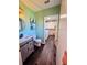 Updated half-bathroom with adjacent laundry room, decorative shelving, and painted walls at 984 S Braun Dr, Lakewood, CO 80228