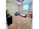 Relaxing bedroom with natural light, an ottoman, pet bed, and carpeted floors at 984 S Braun Dr, Lakewood, CO 80228