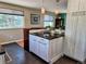 Kitchen island featuring stone countertop with stylish decor and modern cabinetry at 984 S Braun Dr, Lakewood, CO 80228