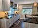 Bright kitchen featuring modern appliances, stone countertops, ample cabinet space and natural light at 984 S Braun Dr, Lakewood, CO 80228