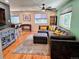 Bright and airy living room with hardwood floors, a comfortable sectional, and stylish accents at 984 S Braun Dr, Lakewood, CO 80228