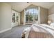 This main bedroom features scenic views, plush carpet, and a serene retreat perfect for relaxation at 18394 Heavens Pl, Monument, CO 80132