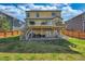 Expansive backyard featuring a two-tiered deck perfect for outdoor entertaining at 9767 Burberry Way, Highlands Ranch, CO 80129