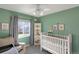 Bright bedroom with playful decor and ample natural light at 9767 Burberry Way, Highlands Ranch, CO 80129