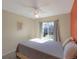 Bright bedroom with a large window offering a view of the neighborhood at 9767 Burberry Way, Highlands Ranch, CO 80129