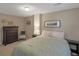 Comfortable bedroom with warm lighting and a soft, inviting bed at 9767 Burberry Way, Highlands Ranch, CO 80129