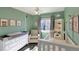 Light-filled bedroom with playful decor and a cozy armchair at 9767 Burberry Way, Highlands Ranch, CO 80129