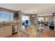 Contemporary kitchen boasts a center island, stainless steel appliances, and seamless flow into the living spaces at 9767 Burberry Way, Highlands Ranch, CO 80129