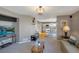 Open living area with eat-in kitchen featuring stainless steel appliances and light colored cabinets at 9767 Burberry Way, Highlands Ranch, CO 80129