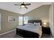 Comfortable main bedroom featuring a vaulted ceiling, carpeted floors and natural light at 9767 Burberry Way, Highlands Ranch, CO 80129