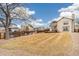 Spacious backyard with wooden fence and deck, perfect for outdoor activities at 10663 Dexter Dr, Thornton, CO 80233
