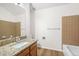 Bathroom with granite countertop, vanity, and tiled walls at 10663 Dexter Dr, Thornton, CO 80233