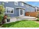 A well maintained backyard with a concrete patio and lawn, offering a perfect space for outdoor activities at 5453 S Quatar Ct, Aurora, CO 80015