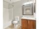 Bathroom with tub, and vanity with stylish countertop and faucet at 5453 S Quatar Ct, Aurora, CO 80015