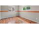 Bedroom with hardwood floors and freshly painted gray walls at 5453 S Quatar Ct, Aurora, CO 80015