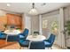 Kitchen and eat-in dining area with hardwood floors, wood cabinets, and white table and chairs at 5453 S Quatar Ct, Aurora, CO 80015