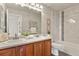 Spacious main bathroom featuring double sinks and tile shower at 5453 S Quatar Ct, Aurora, CO 80015