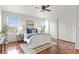 Bright bedroom with hardwood floors, a ceiling fan, and lots of natural light at 5453 S Quatar Ct, Aurora, CO 80015