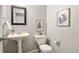 Stylish powder room with modern fixtures and decorative wall art at 5453 S Quatar Ct, Aurora, CO 80015